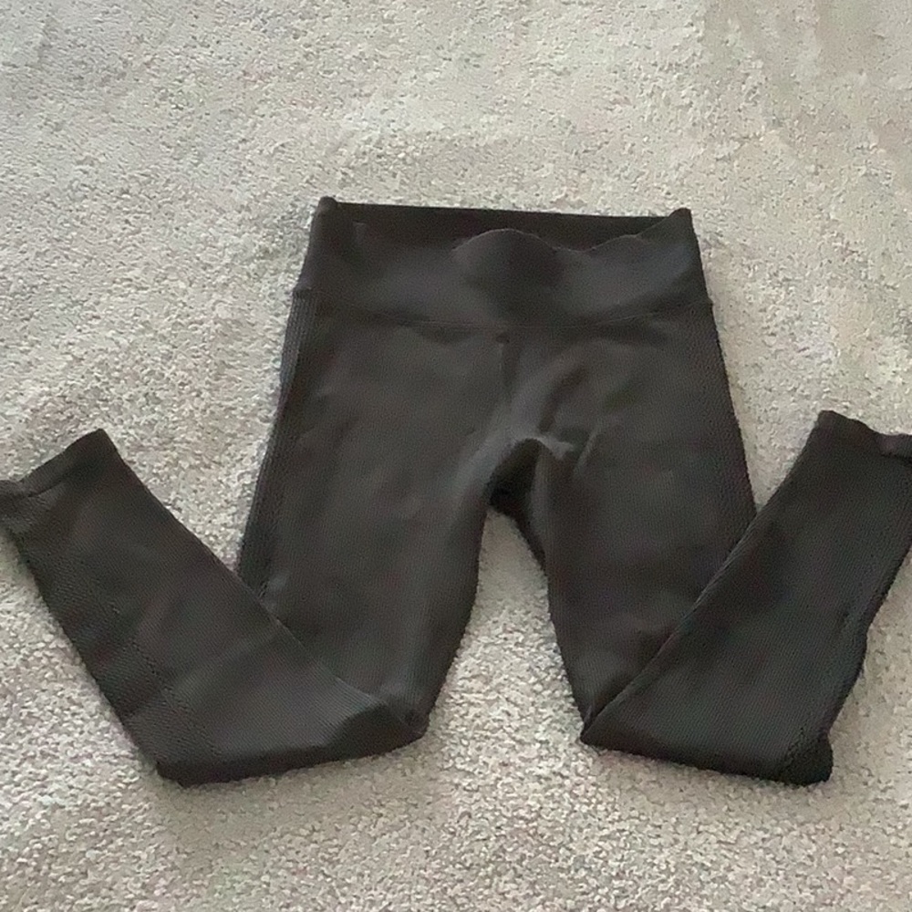 Black stretch leggings, wide waistband and side design. No tags. See pictures.